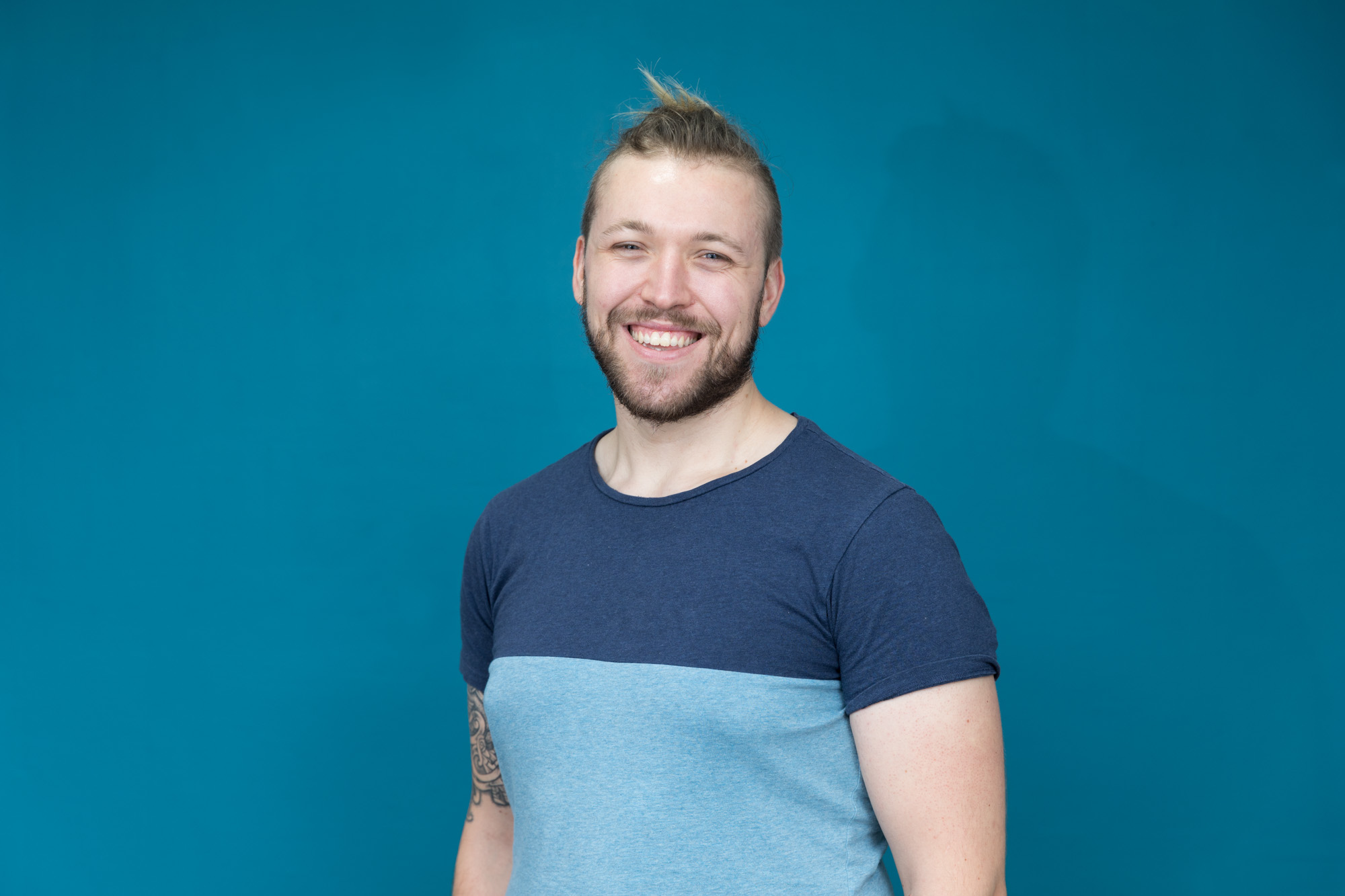 A vibrant blue background showing an example of London headshot photography