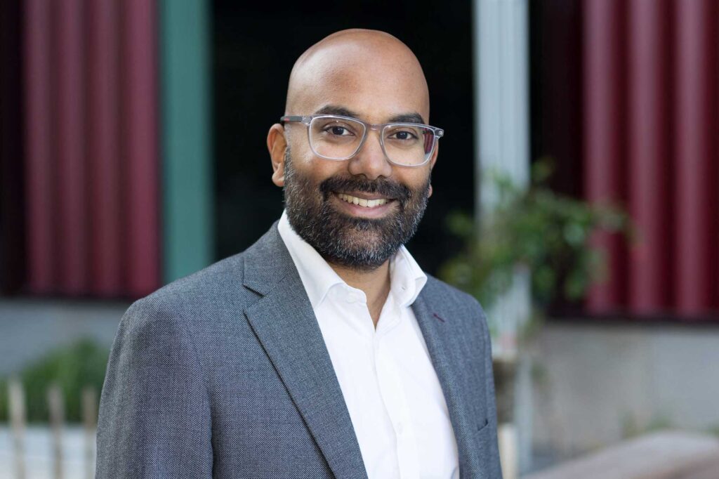 LinkedIn profile photo of a business man in a grey jacket taken in Croydon, London