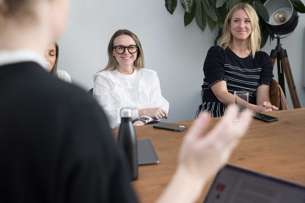 A corporate team meeting in the office as an example of lifestyle photography