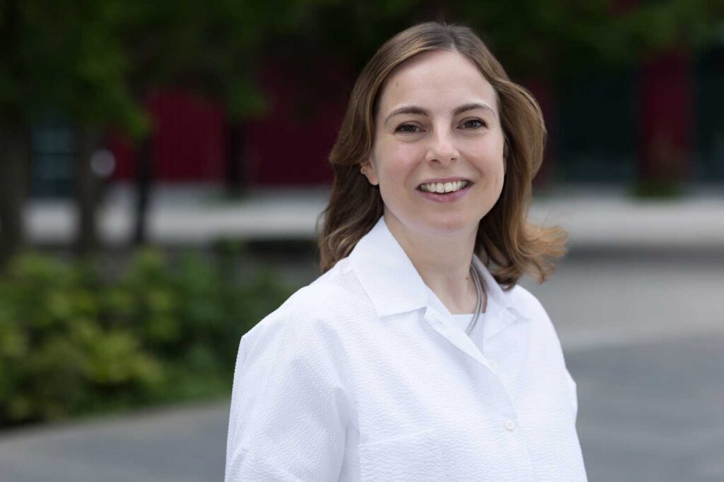 An example of what to wear for a professional headshot; a businesswoman with a relaxed look wears a white shirt in Croydon, South East London