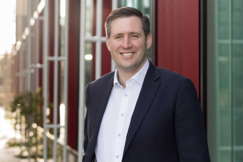 An example of what to wear for a professional headshot if you work in the financial world. A photo of a businessman in a suit jacket taken in Croydon, South East London.