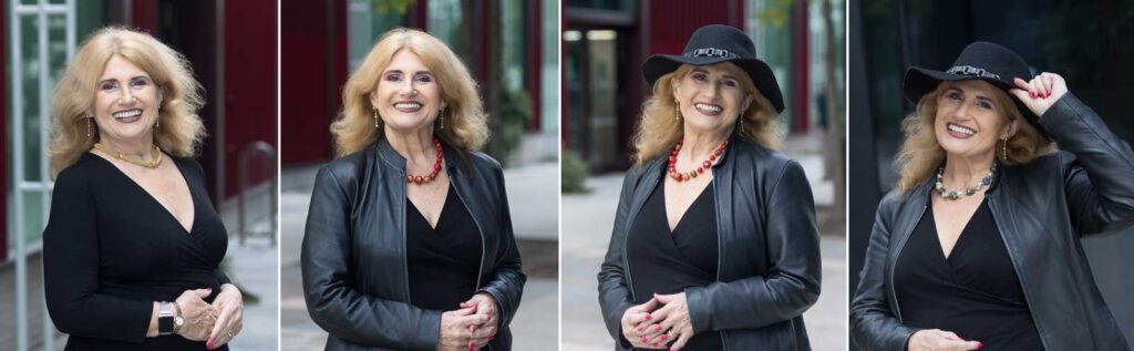 An example of what to wear for a professional headshot; a business woman changes her look by adding accessories to her outfit. She wears a black jacket, bright jewellery & a hat