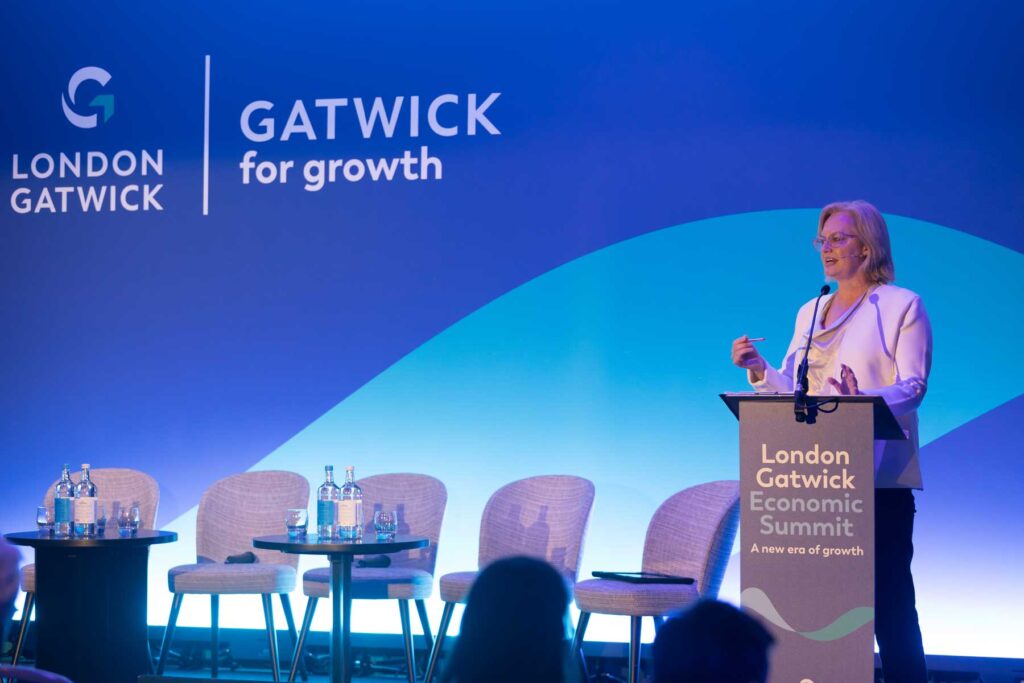 Photography of the chair introducing the event from the stage at the London Gatwick Economic Summit